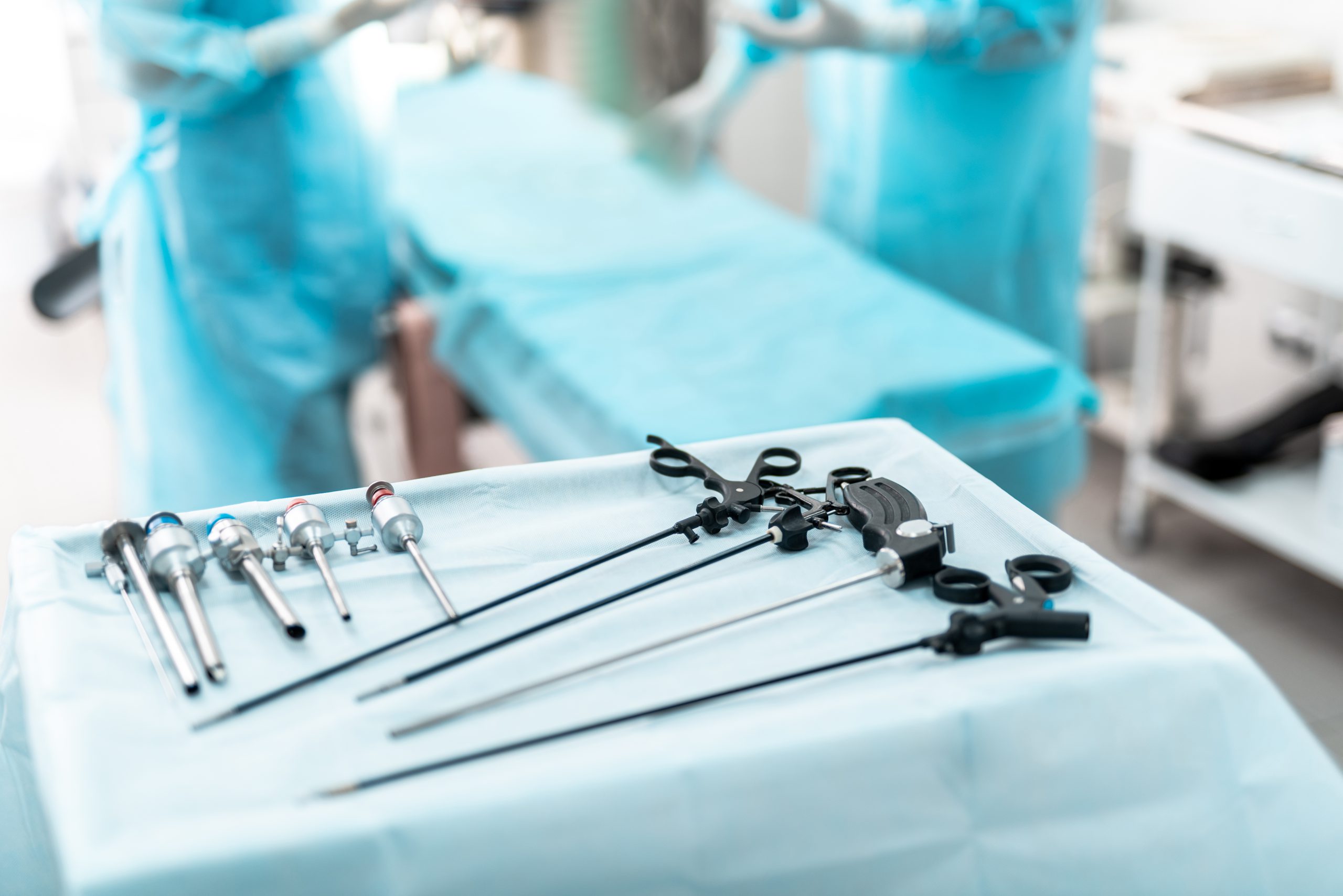 Laparoscopic surgical instruments on sterile desk in operating room